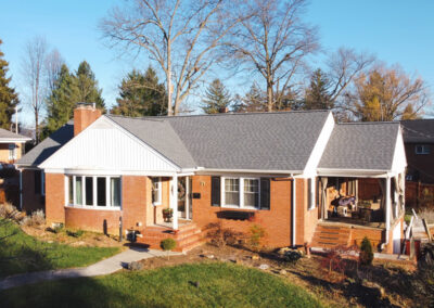 Red Brick house with grey shingles