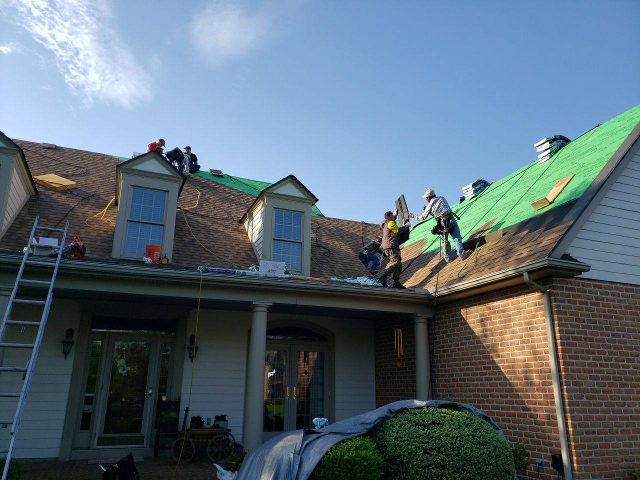 men working on roof Construction